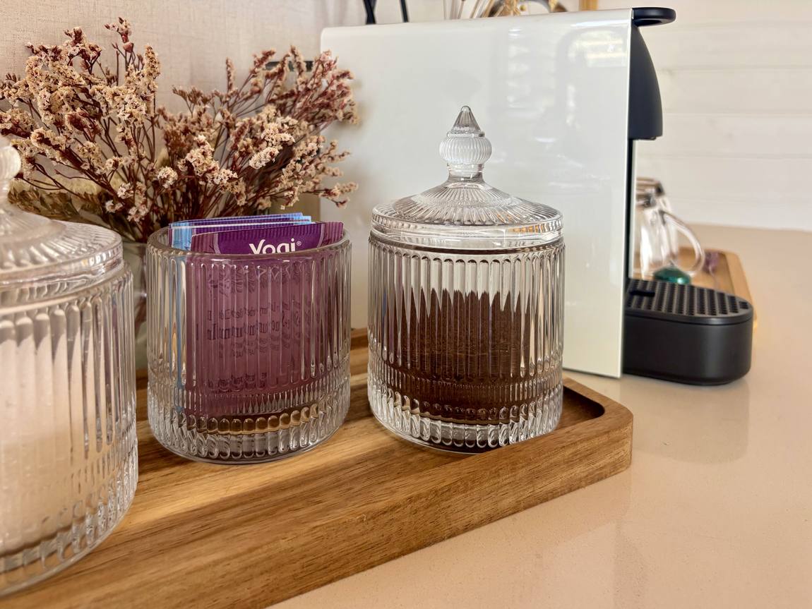 Coffee and tea jars with dried flowers in the coffee corner
